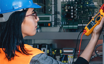 A Jacobs employee in PPE inspecting equipment at the Jacobs Inspection Validation Centre (IVC) at Birchwood Park.