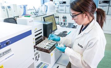 A Jacobs employee working at the Specialist Scientific Laboratory Hub in Birchwood Park.