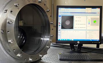 AEON small vacuum chamber next to computer showing chamber results